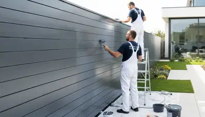 Fence painting in Tampa, FL by Tampa Paint Pros for weather protection and curb appeal